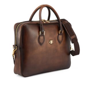 Luxury brown leather briefcase with top handles and detachable shoulder strap on a white background.
