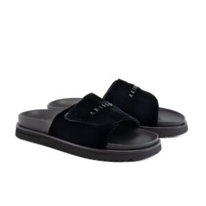Aristo black velvet slides featuring signature lettering and a chunky ridged black sole.